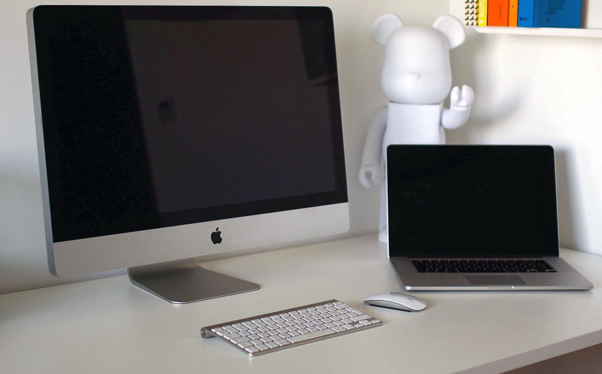 clean workspace with laptop and notebook
